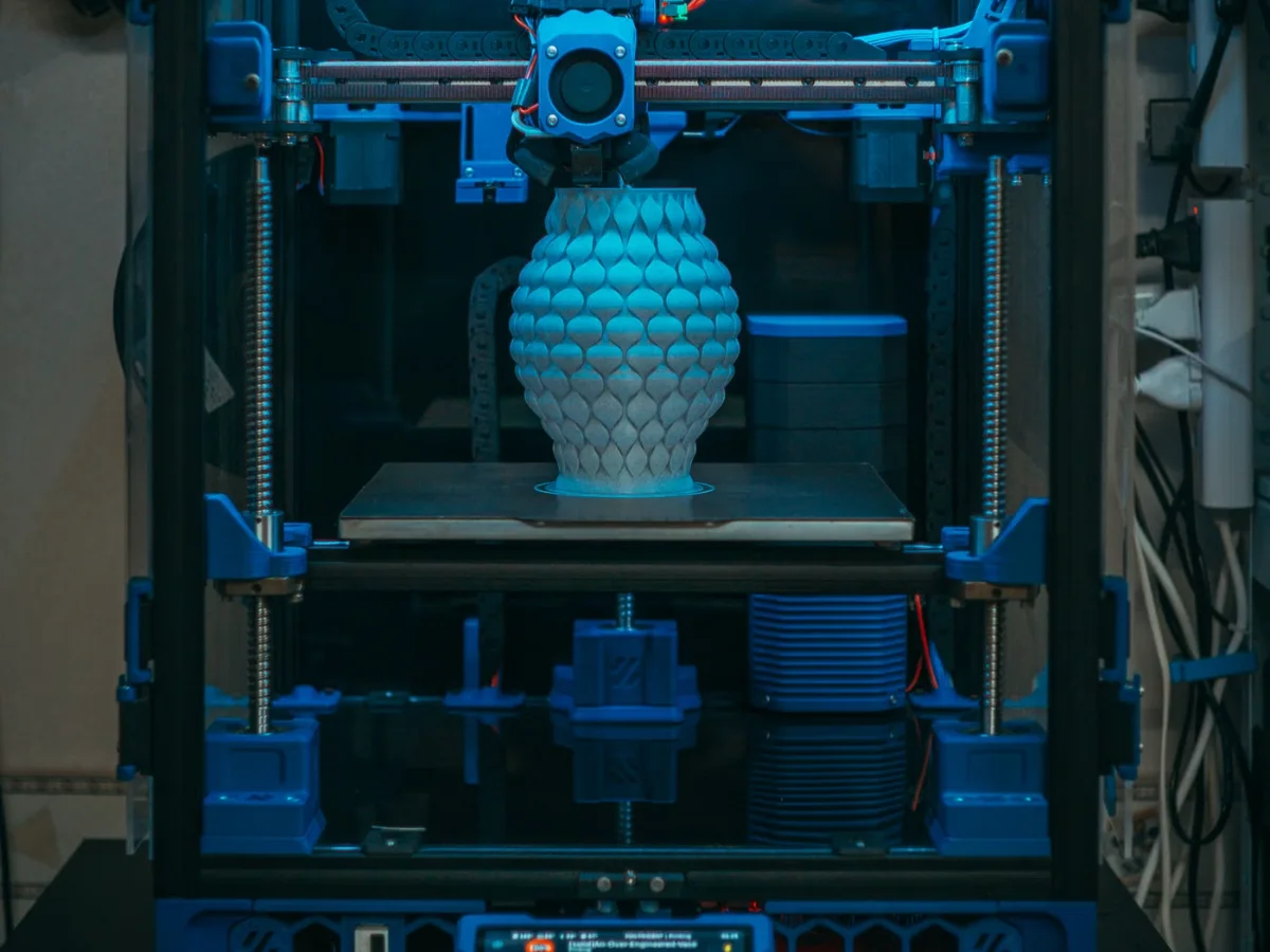 A 3D printer printing a vase