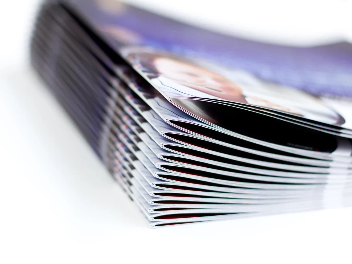 Stack of saddle-stitched printed booklets