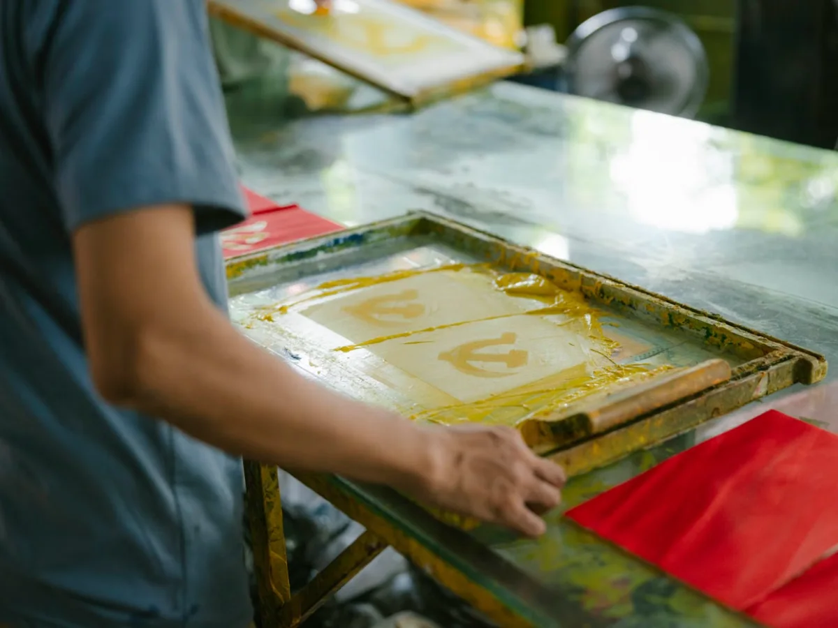 Screen printing a design onto apparel